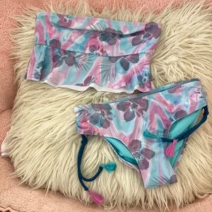 Two piece Hawaiian swimsuit with tassels. Great for summer
